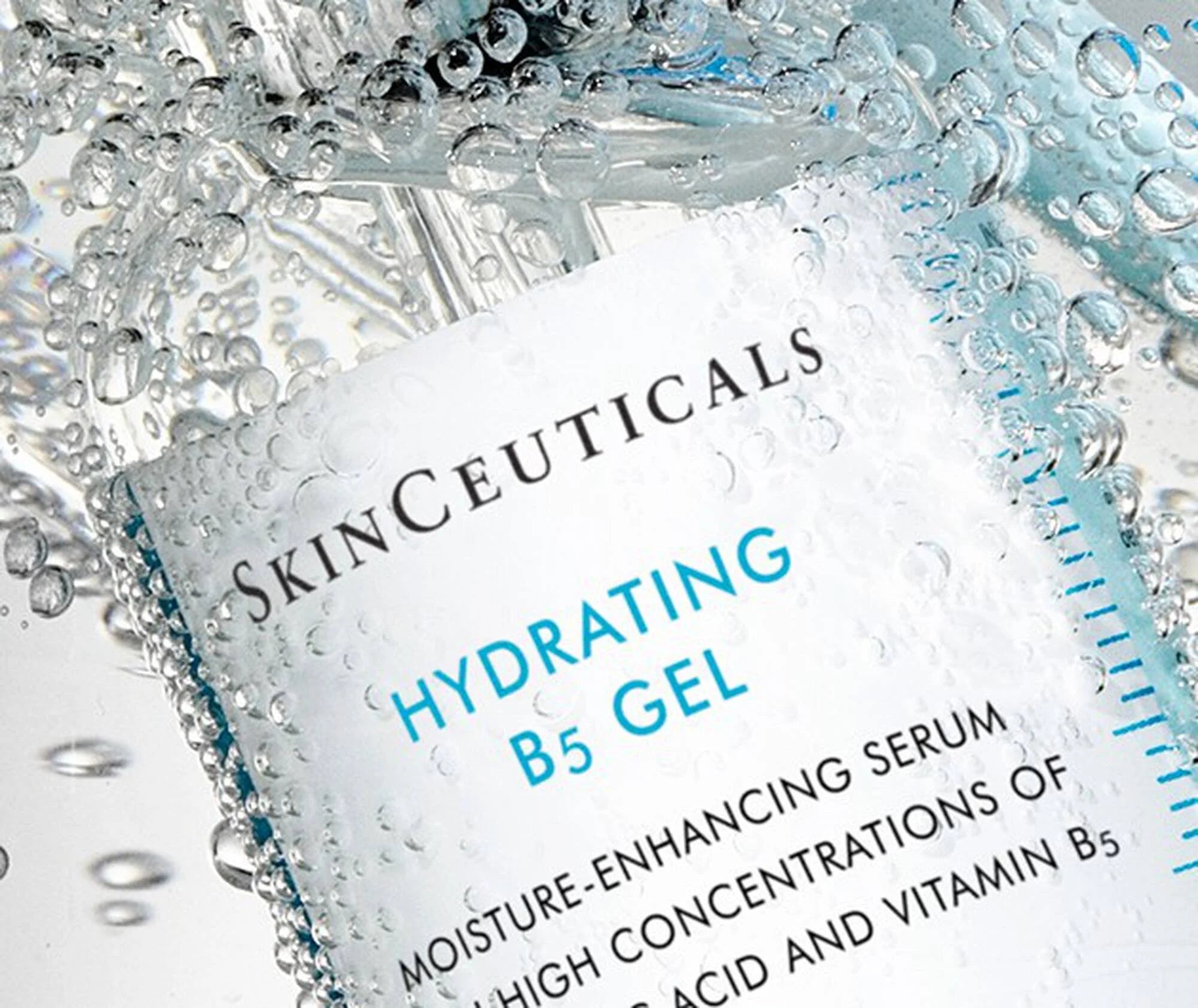 SkinCeuticals Hydrating B5 Gel packaging with water droplets on a white background