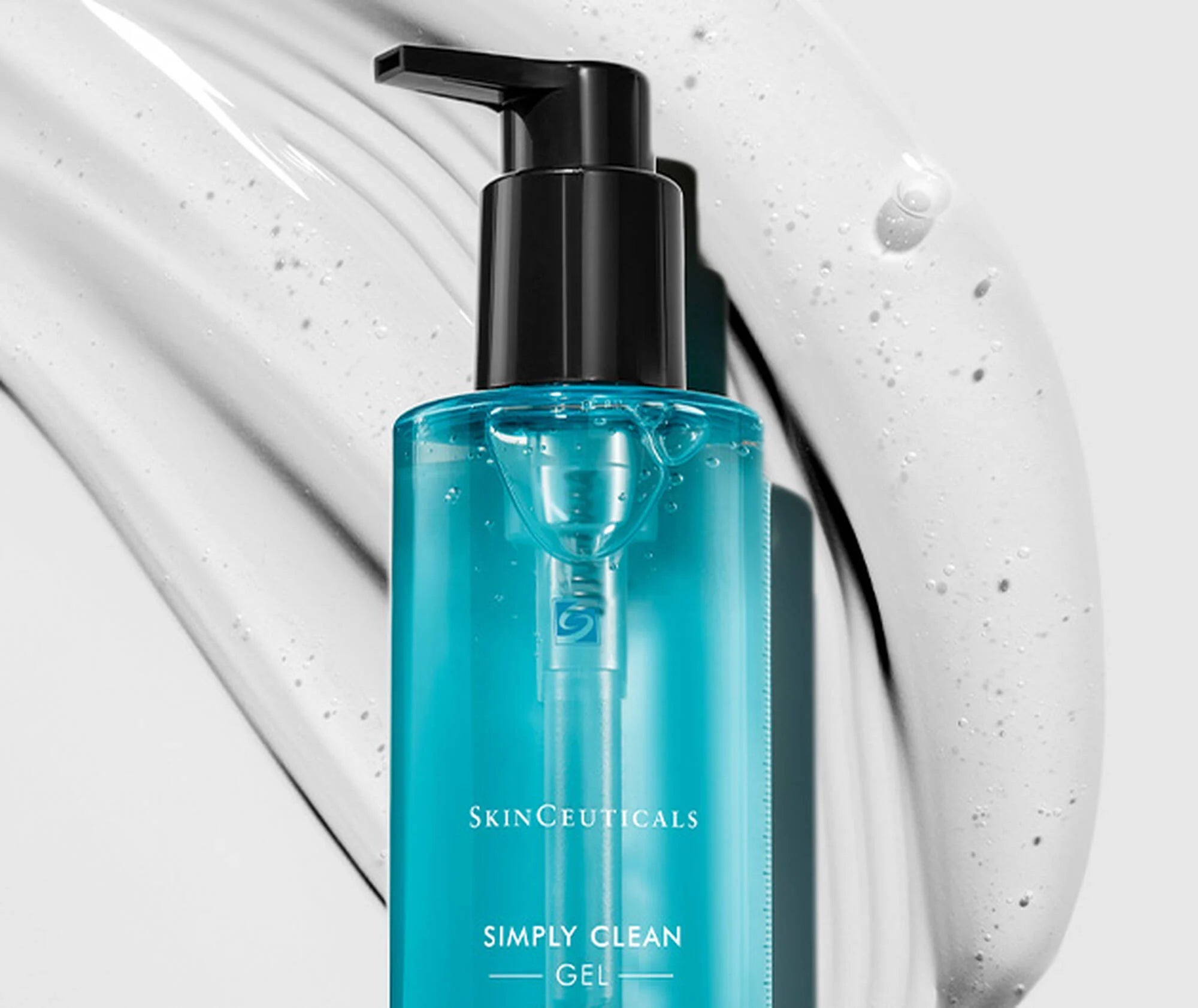 Blue bottle of SkinCeuticals Simply Clean Gel with a pump on a white background