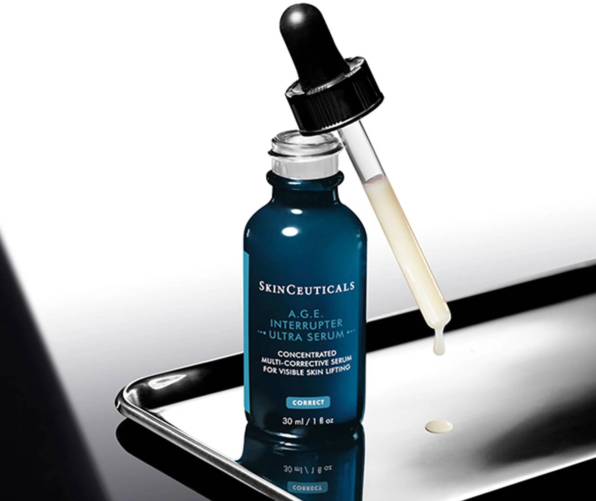 SkinCeuticals A.G.E. Interrupter Ultra Serum dropper bottle on a reflective surface.