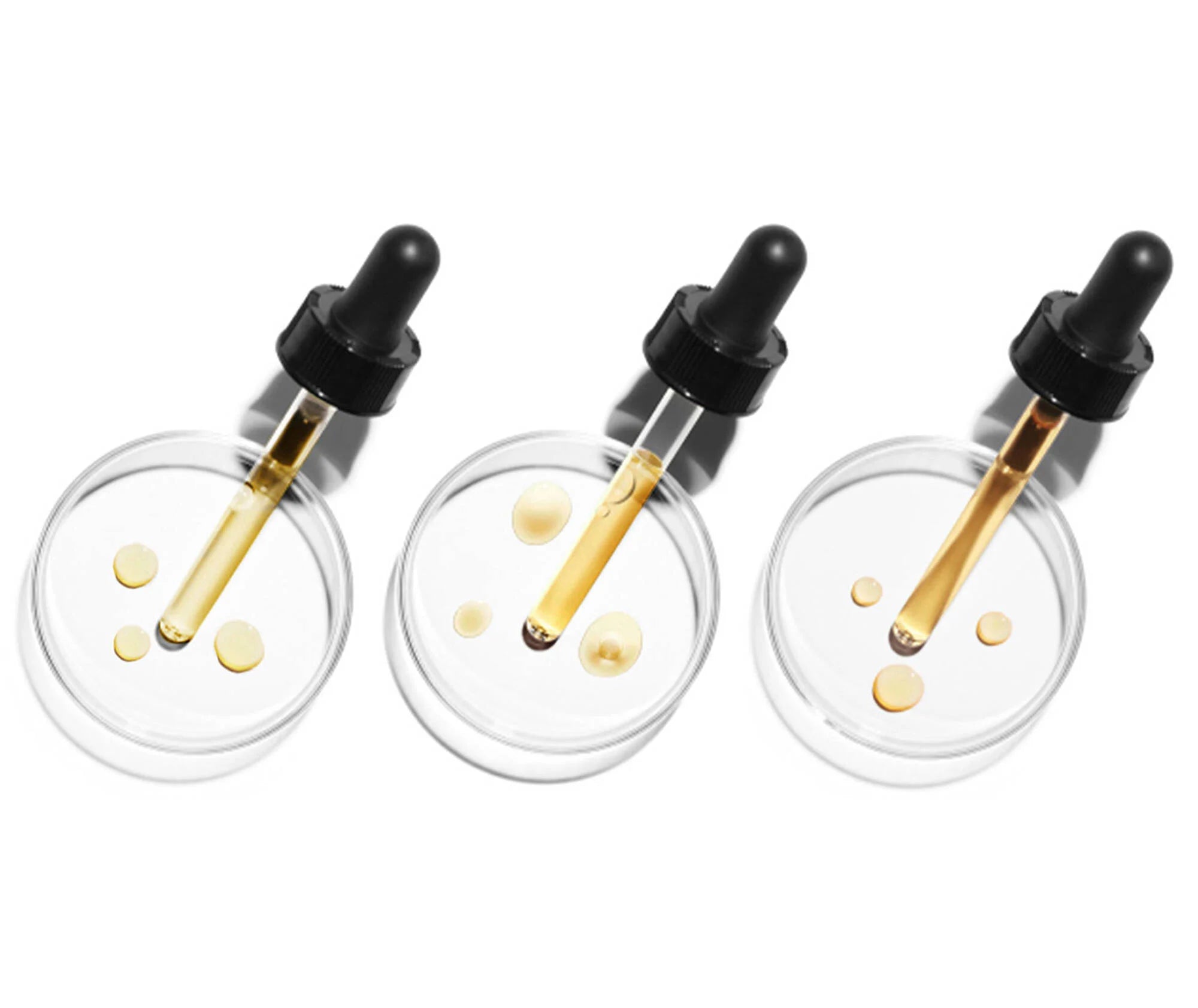 Three dropper bottles with clear containers and black lids on a white background