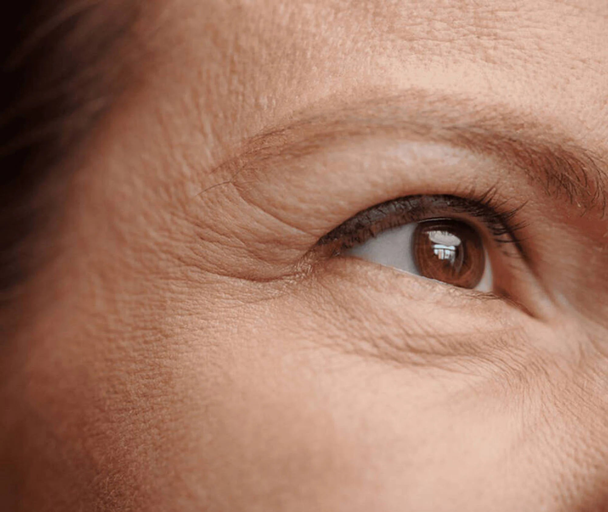 Close-up of a person's eye with detailed skin texture