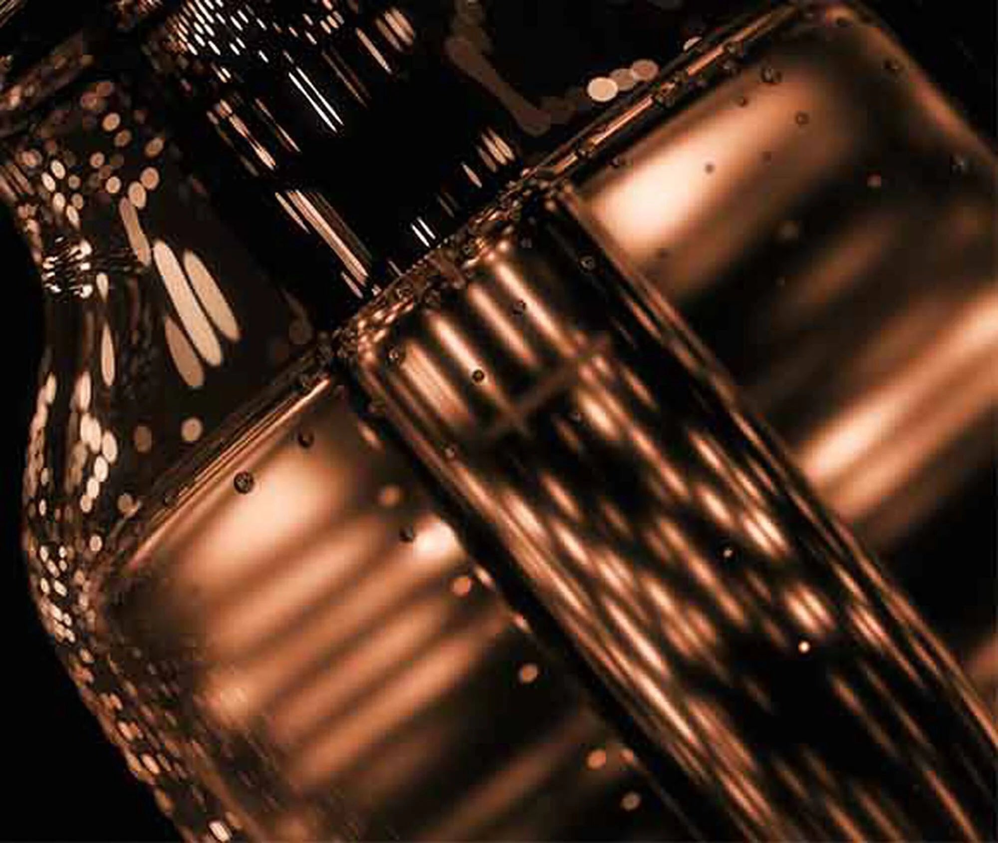 Close-up of a metallic gear with a reflective surface