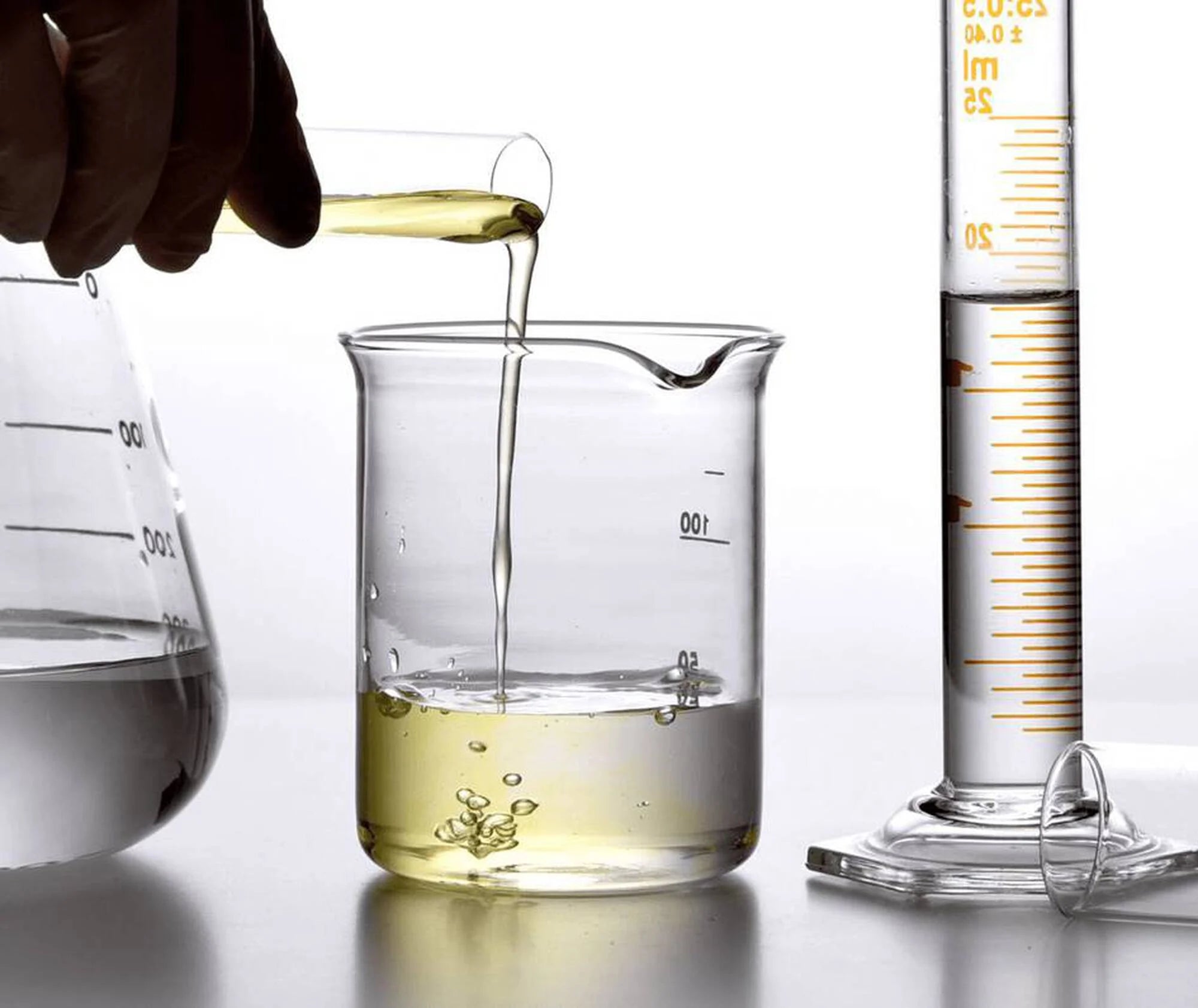 Laboratory setting with beakers and measuring instruments on a white background
