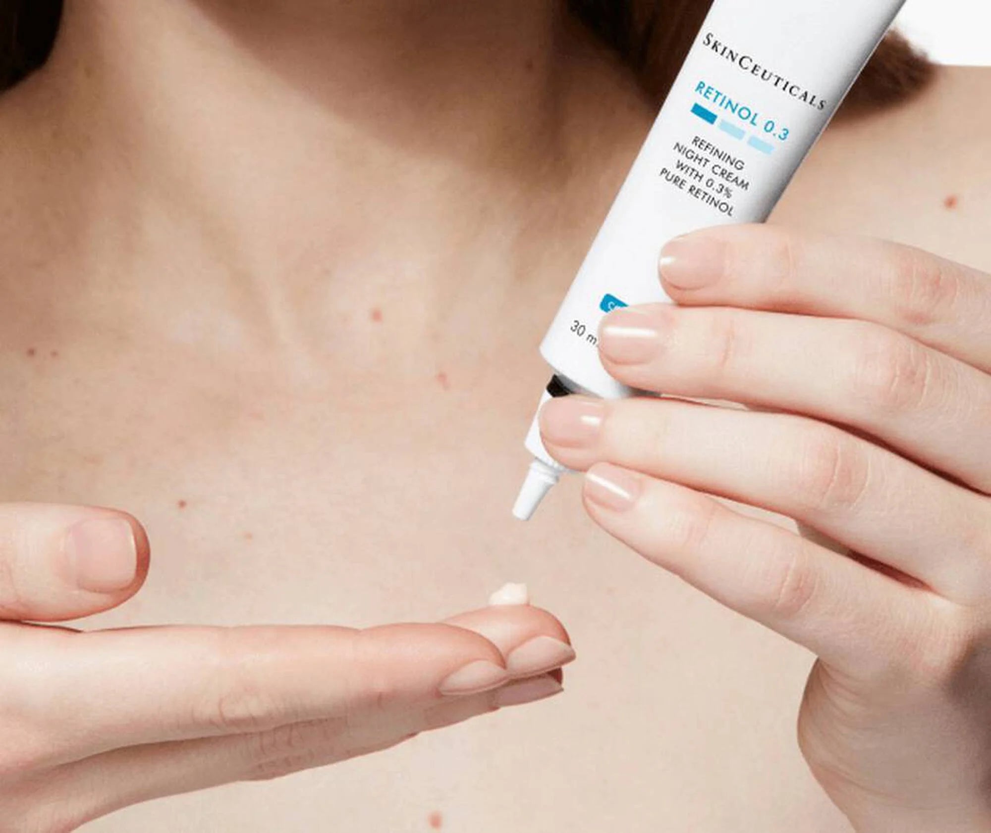 Person applying SkinCeuticals Retinol 0.3 cream to their skin