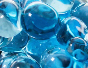 Blue gel beads in a clear container