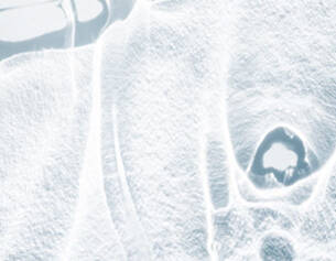 Close-up of a textured white surface with circular patterns