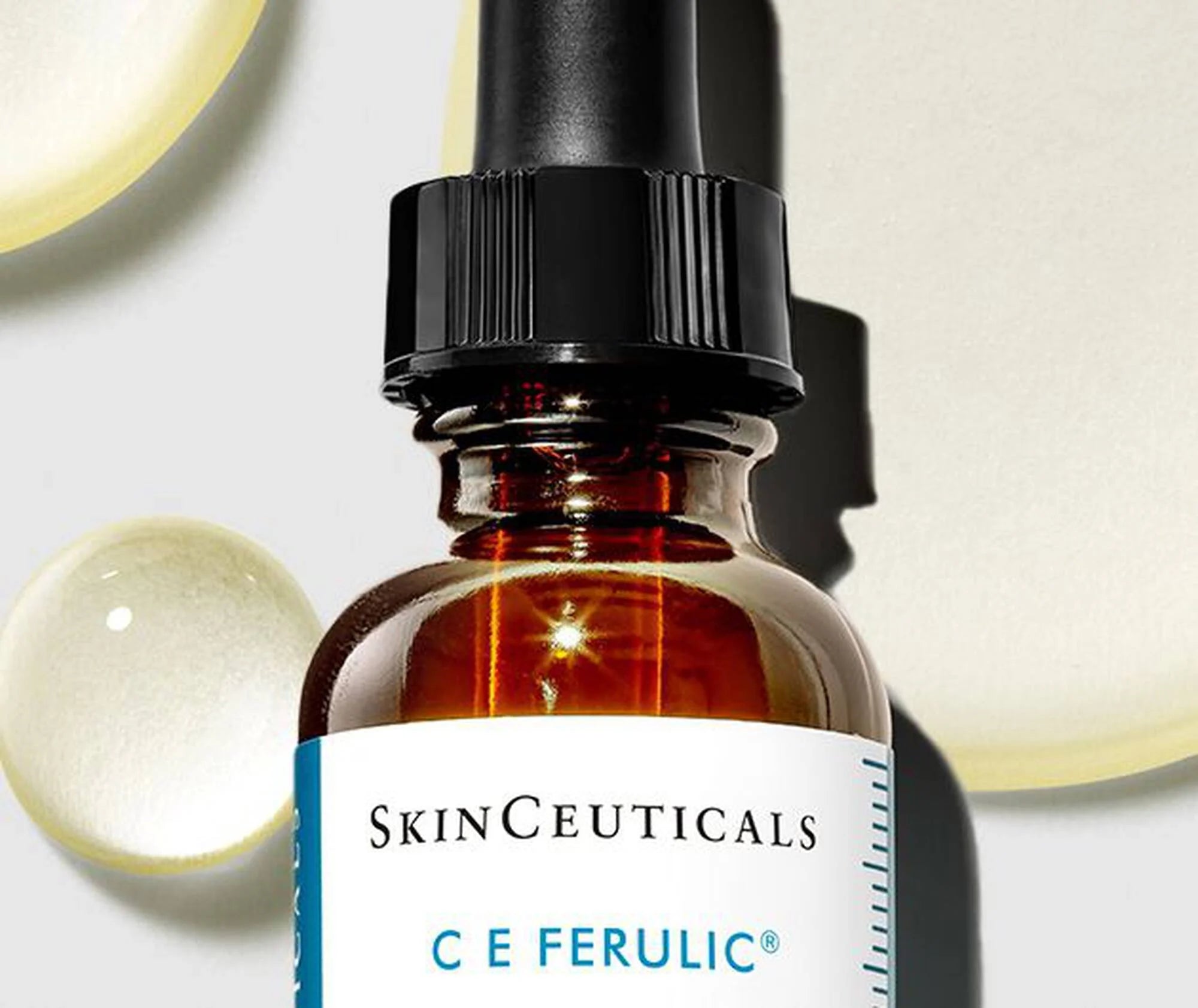 SkinCeuticals C E Ferulic skincare serum bottle with dropper on a neutral background
