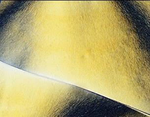 Close-up of a sword blade with a metallic sheen on a dark background
