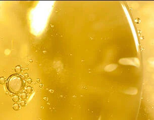 Close-up of a yellow liquid with bubbles