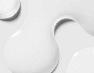 Close-up of white ceramic plates with a subtle texture