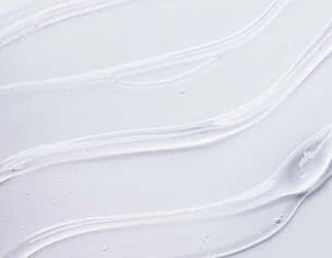 Close-up of white fabric with subtle texture on a light gray background