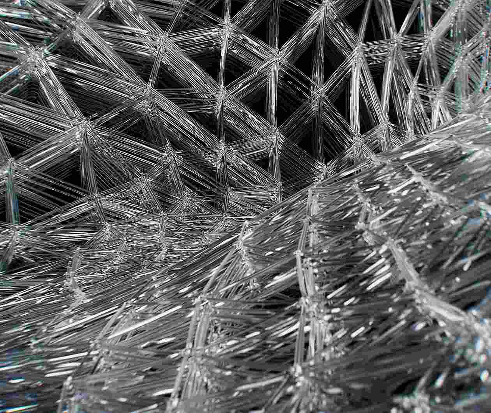 Close-up of metallic fibers arranged in a crisscross pattern
