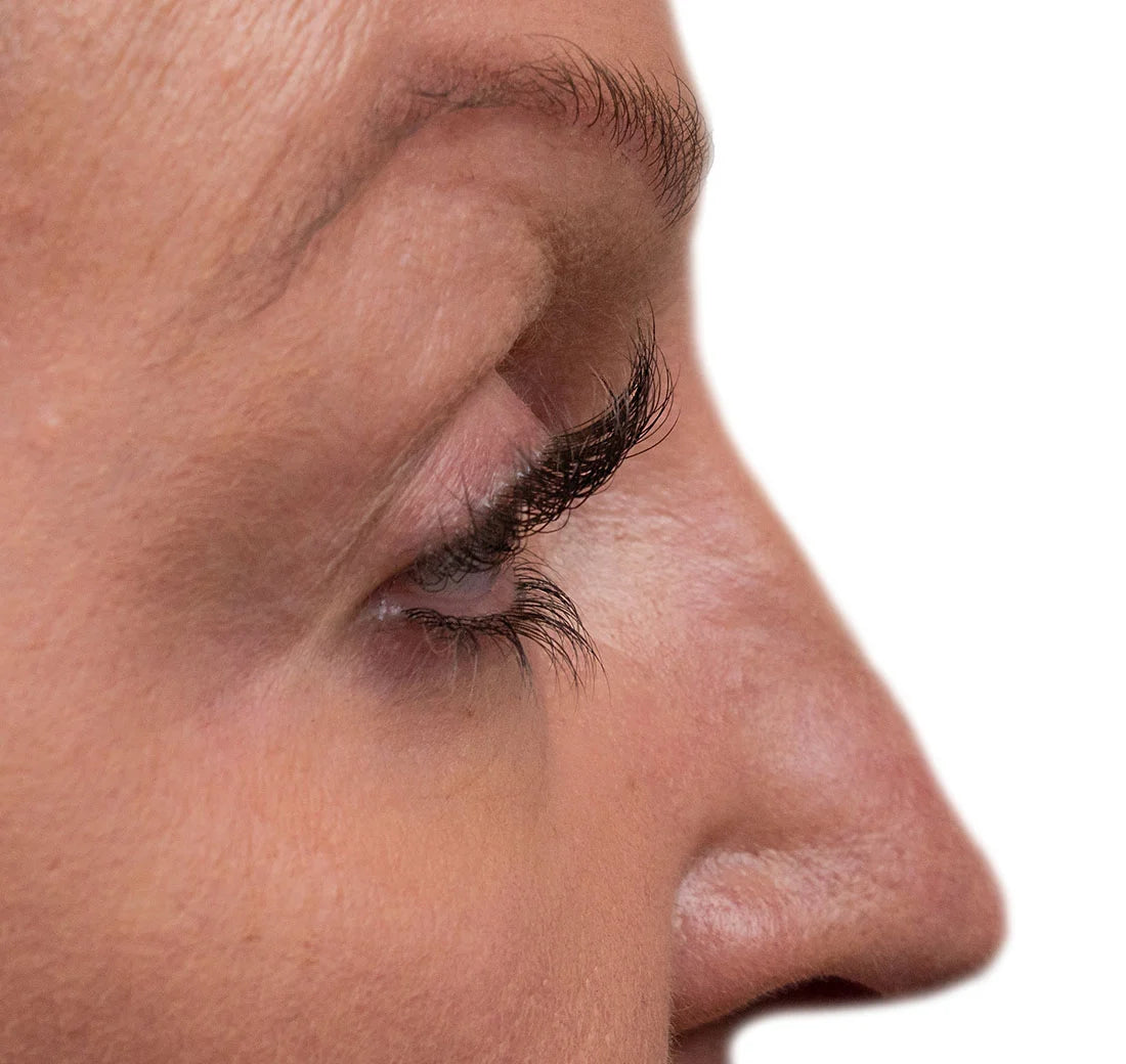Close-up of a person's eye with a white background