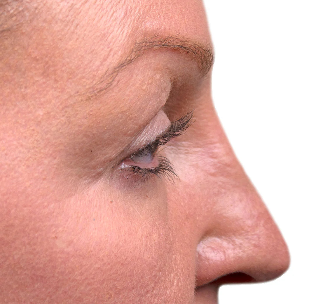 Close-up of a person's eye with a white background