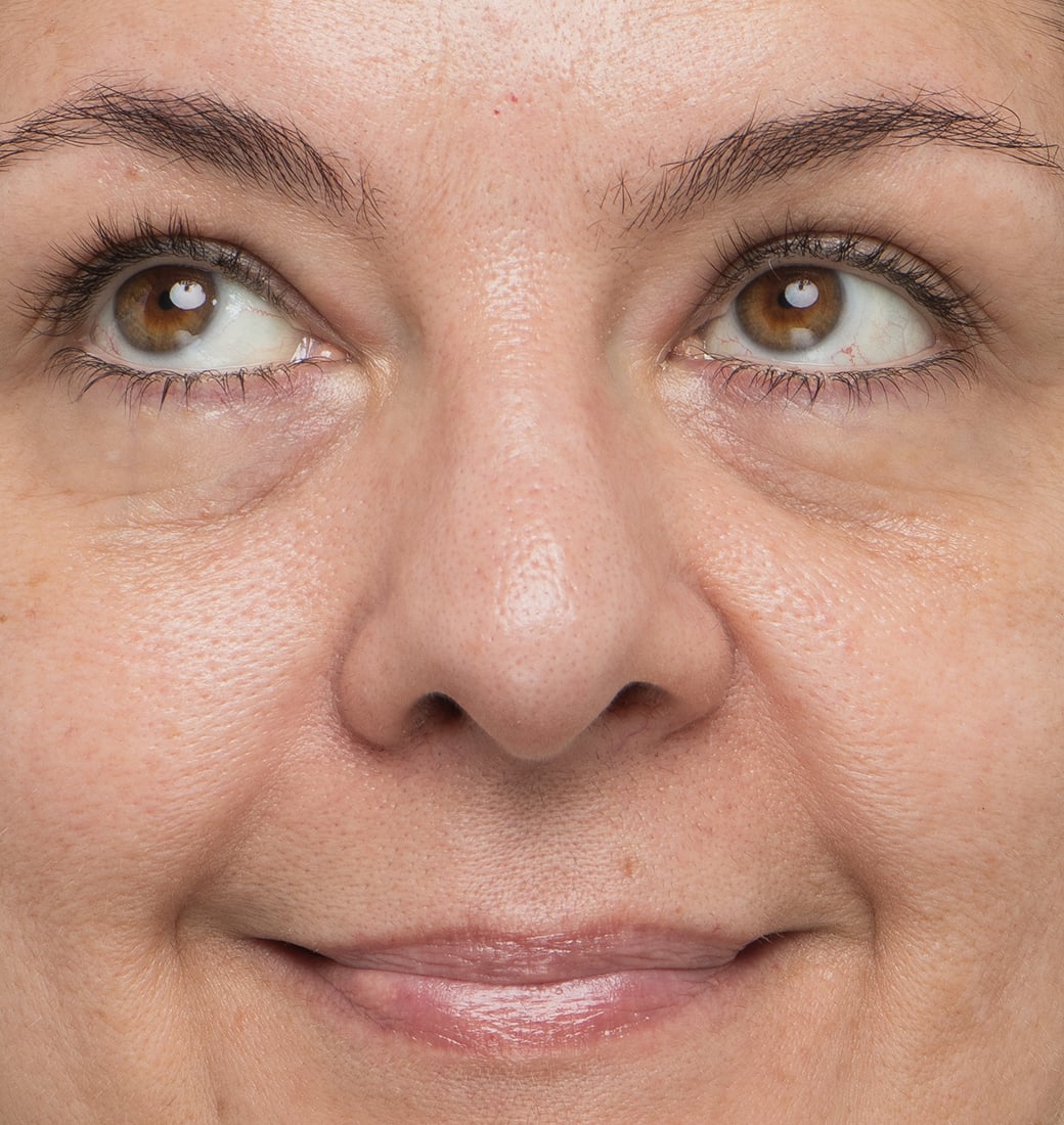 Close-up of a woman's face with a neutral expression