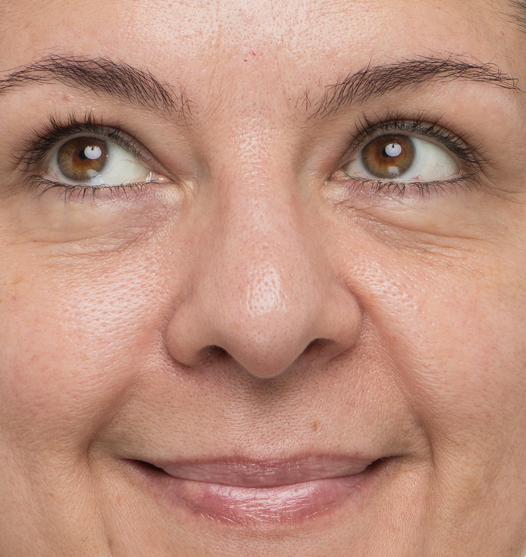 Close-up of a woman's face with a neutral expression