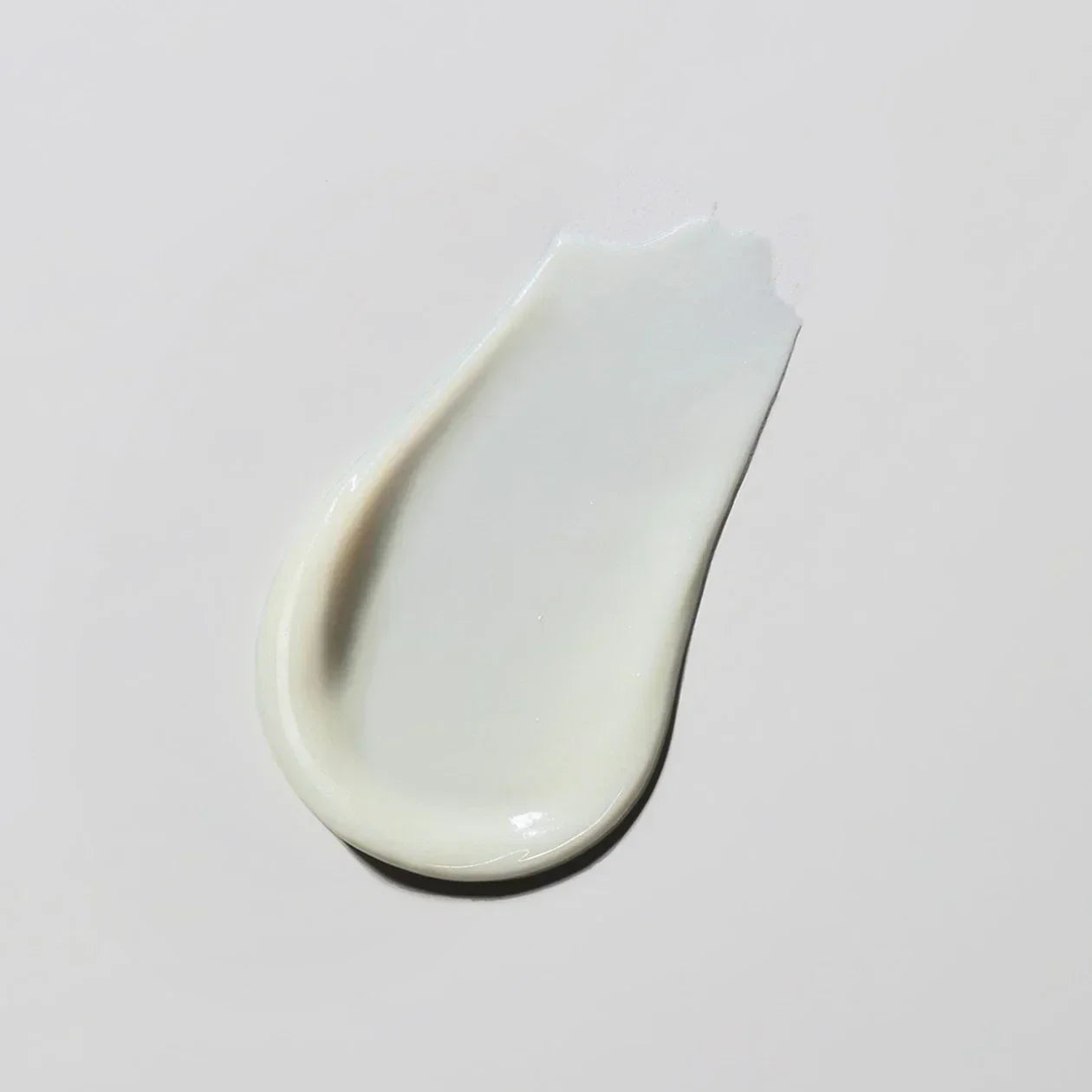 White cream on a light gray background