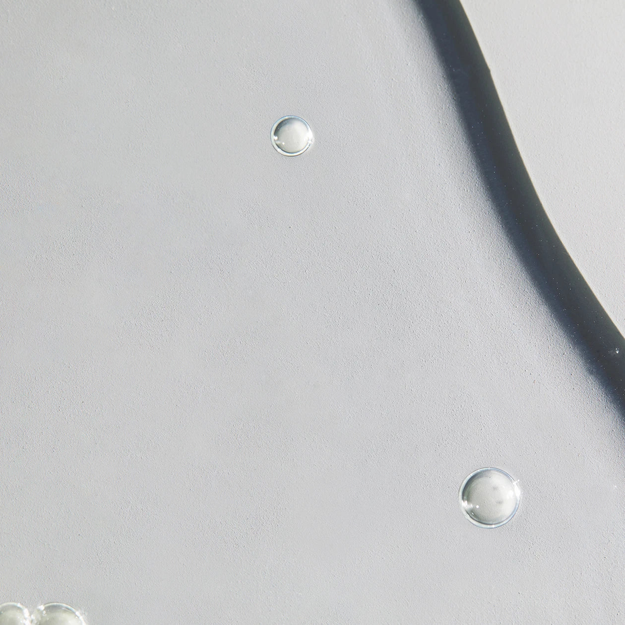 Close-up of silver earrings on a light gray background