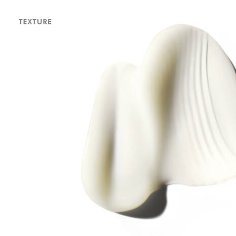 Close-up of a smooth, beige-colored texture on a white background