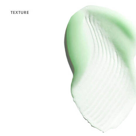 Close-up of green and white textured smear on a white background