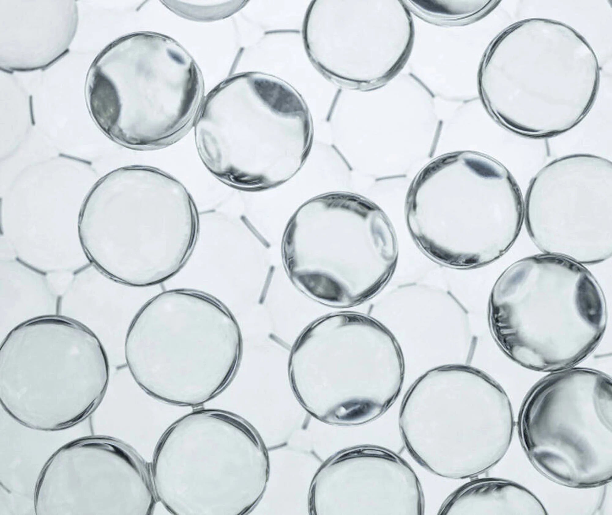 Clear glass marbles on a white background