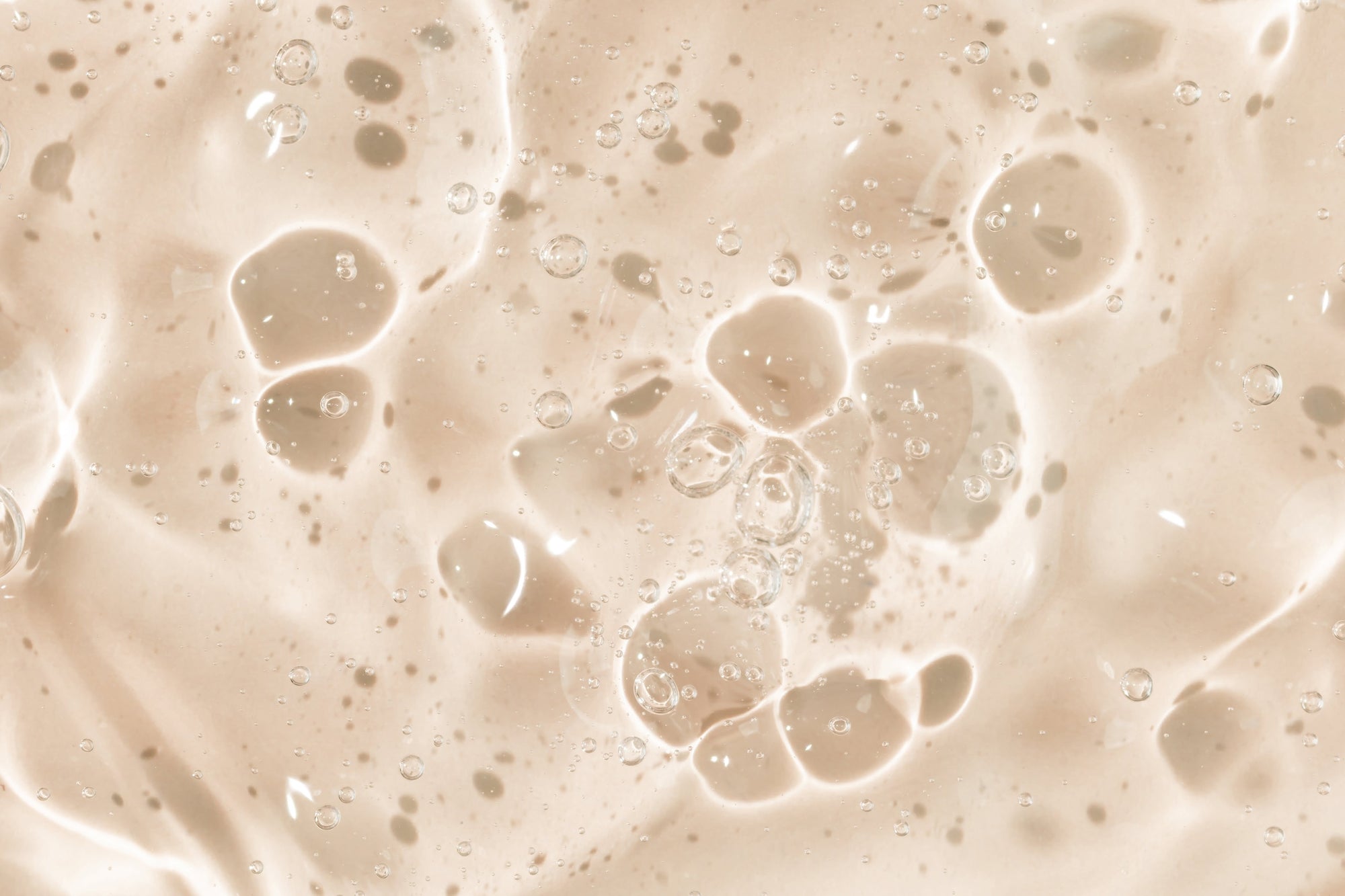 Close-up of beige cream with bubbles