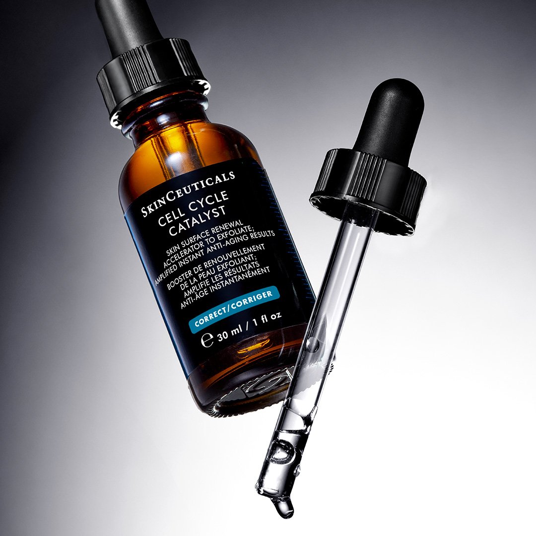 SkinCeuticals Cell Cycle Catalyst serum bottle with dropper on a gradient background